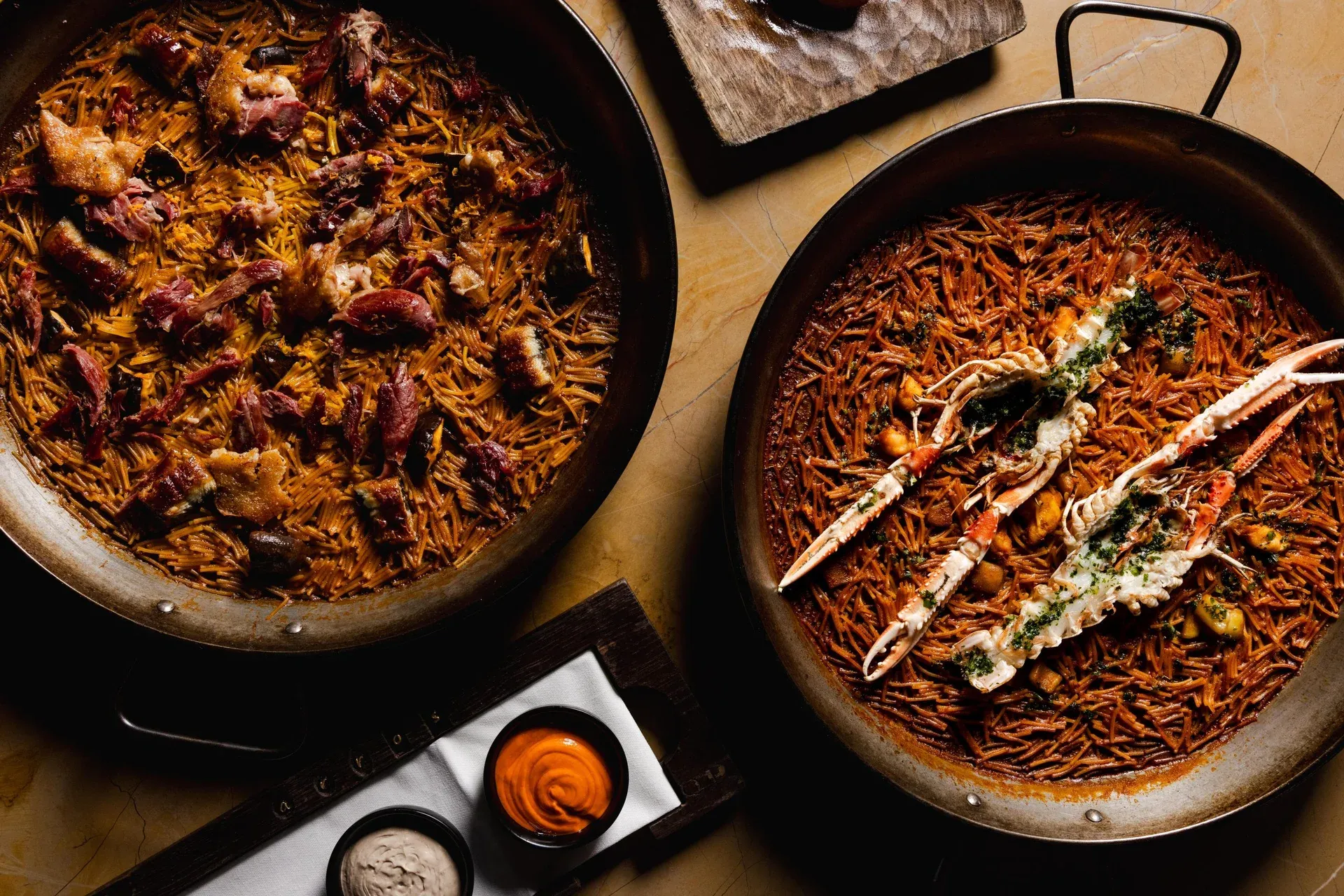 A seafood paella from Arros QD, cooked over fire
