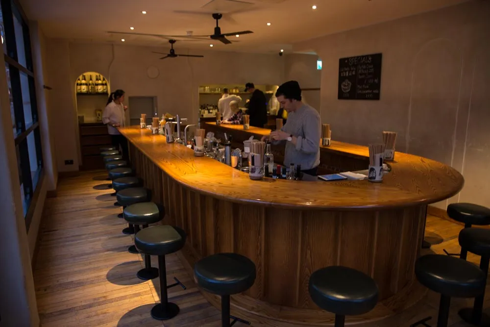 The U-shaped wooden bar at BAO Fitz