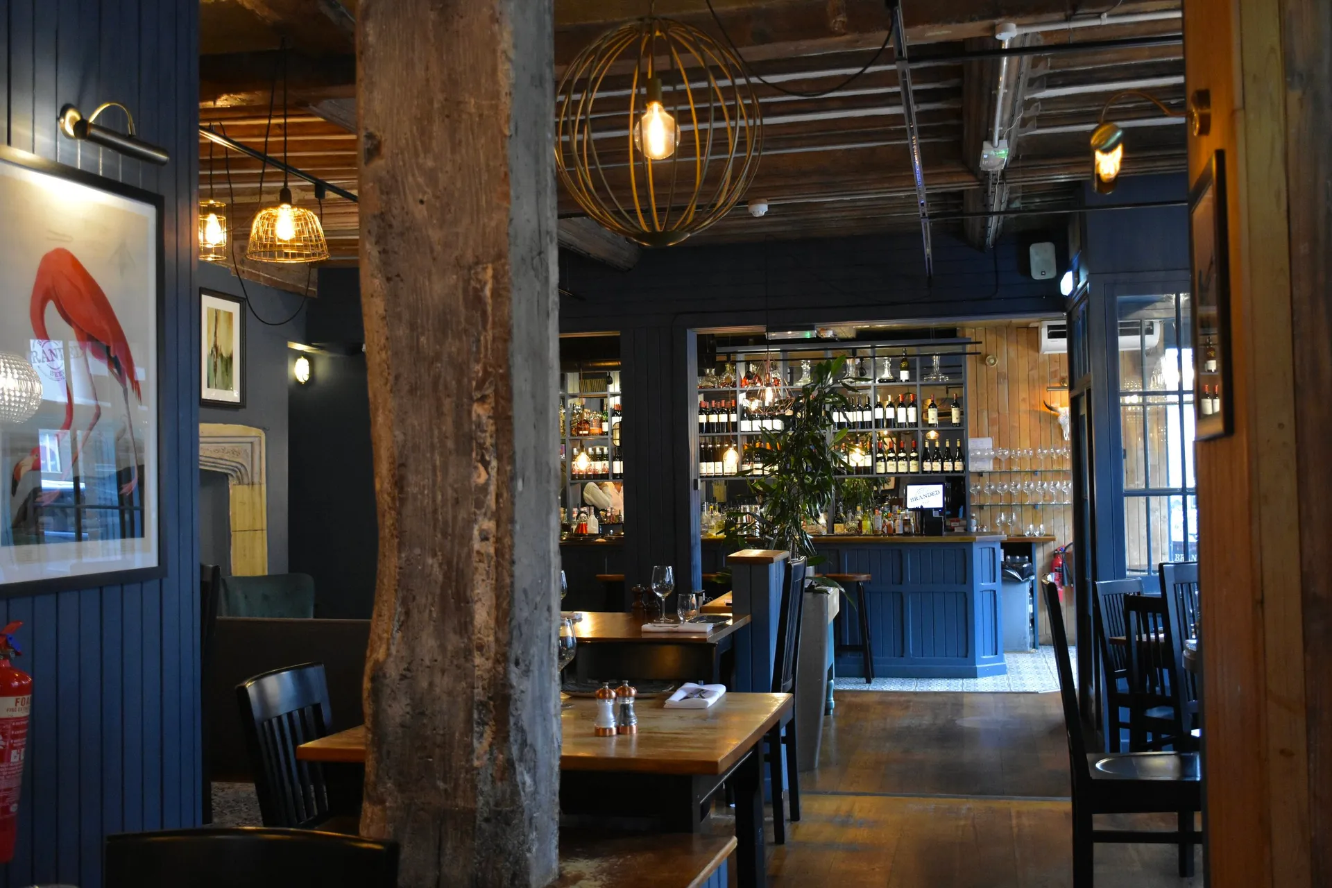 The warm, timber-lined dining room at Branded Sevenoaks