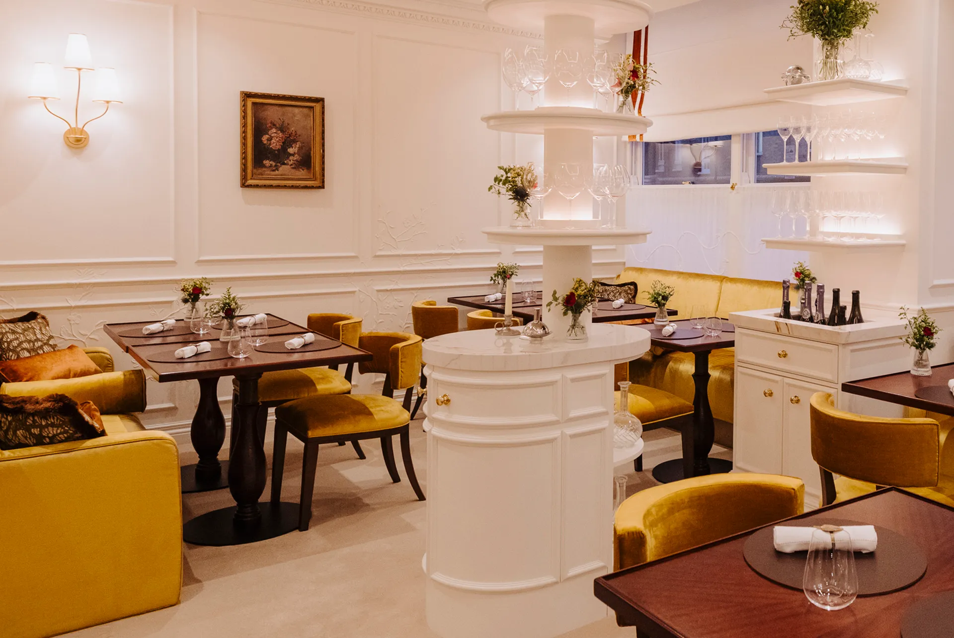 The white-panelled dining room with marble service pillar at Core by Clare Smyth in Notting Hill