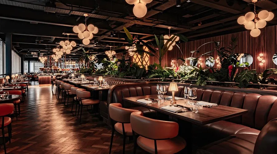 The warm, plant-filled dining room at Fazenda Bishopsgate