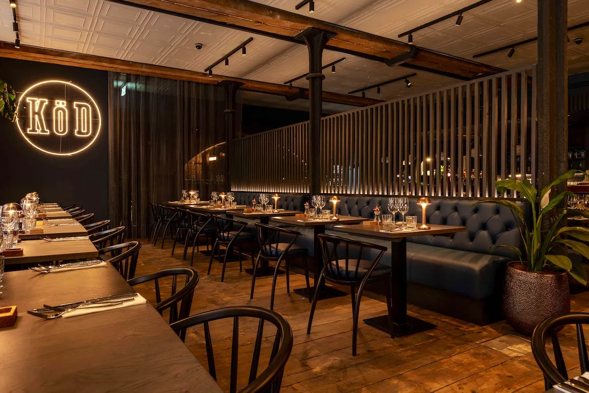 The candlelit dining room at Restaurant KÖD London